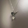 Vintage Skull guitarist necklace