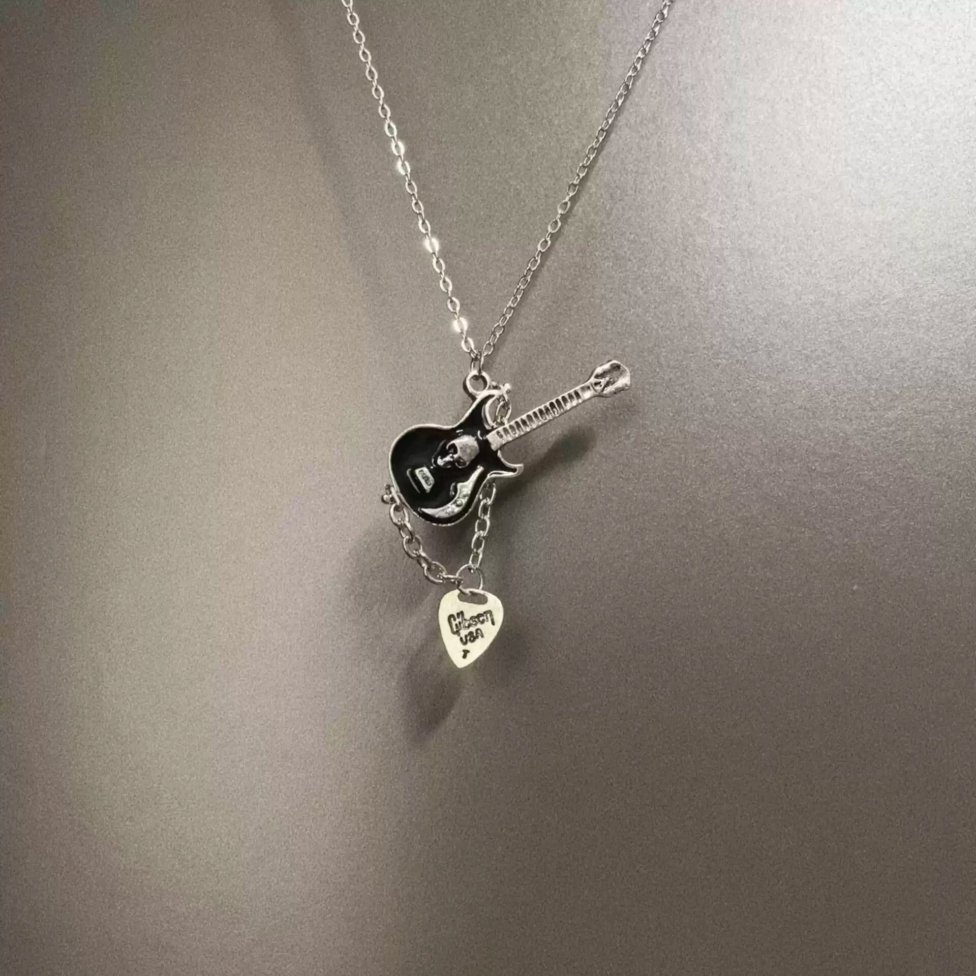 Vintage Skull guitarist necklace