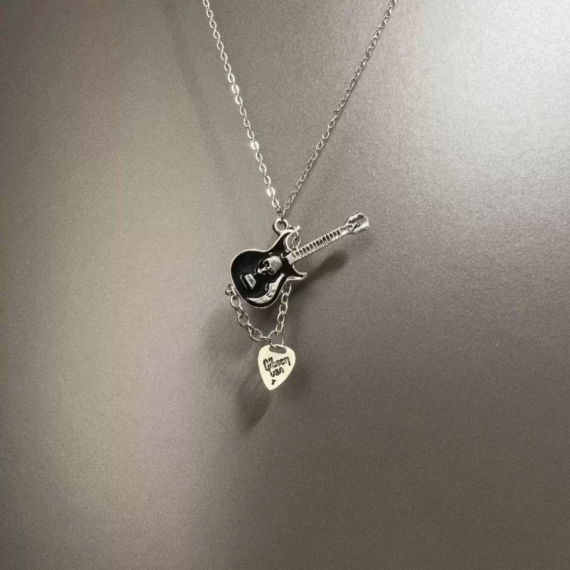 Vintage Skull guitarist necklace